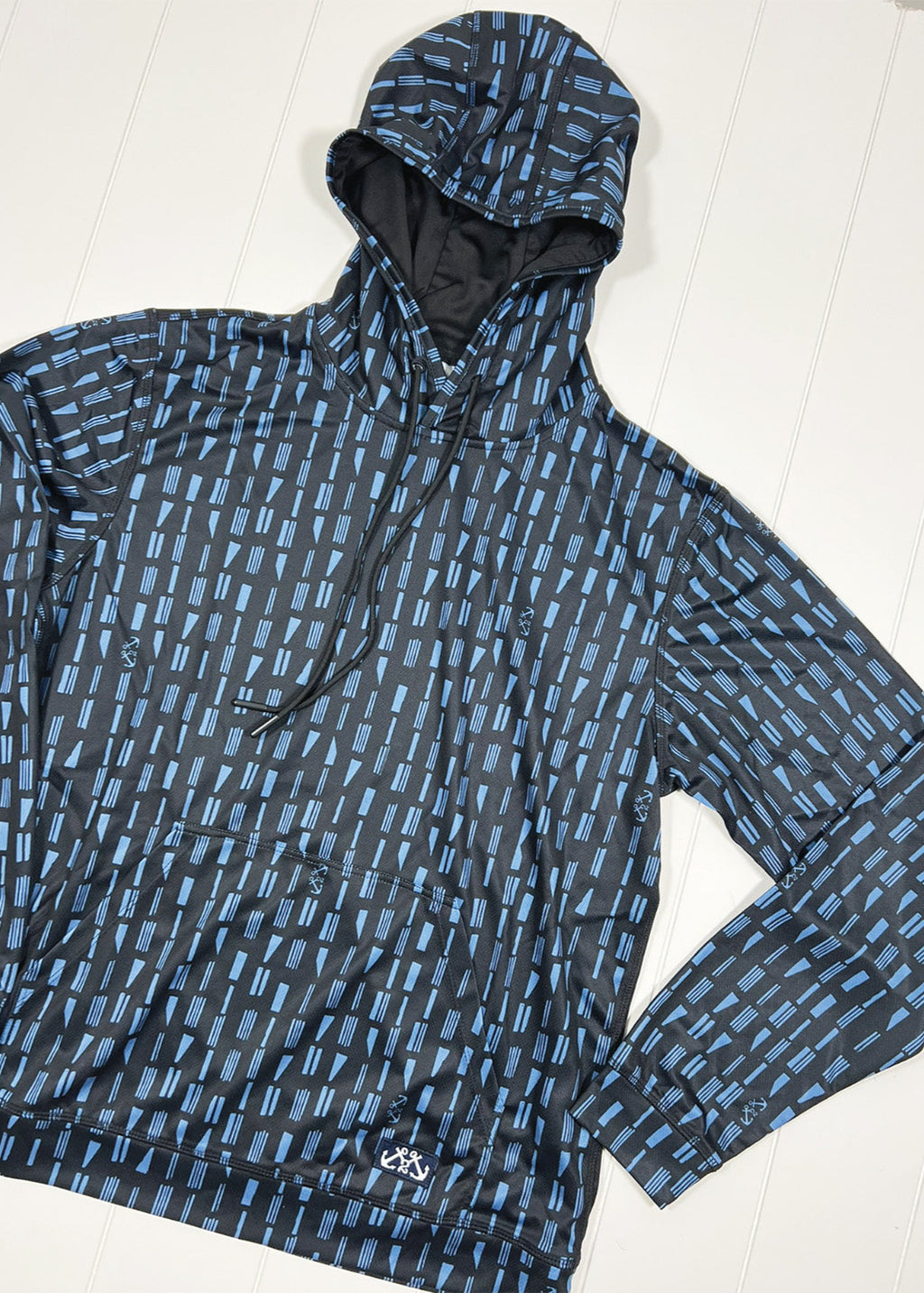 Blue and black patterned raincoat on a white background