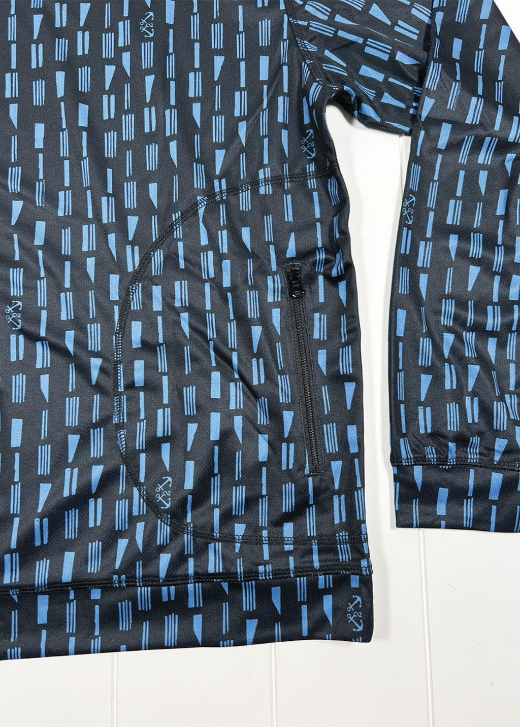 Black and blue patterned long-sleeve shirt on a white background
