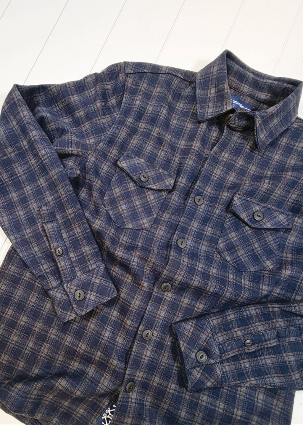 Blue plaid shirt on a white background