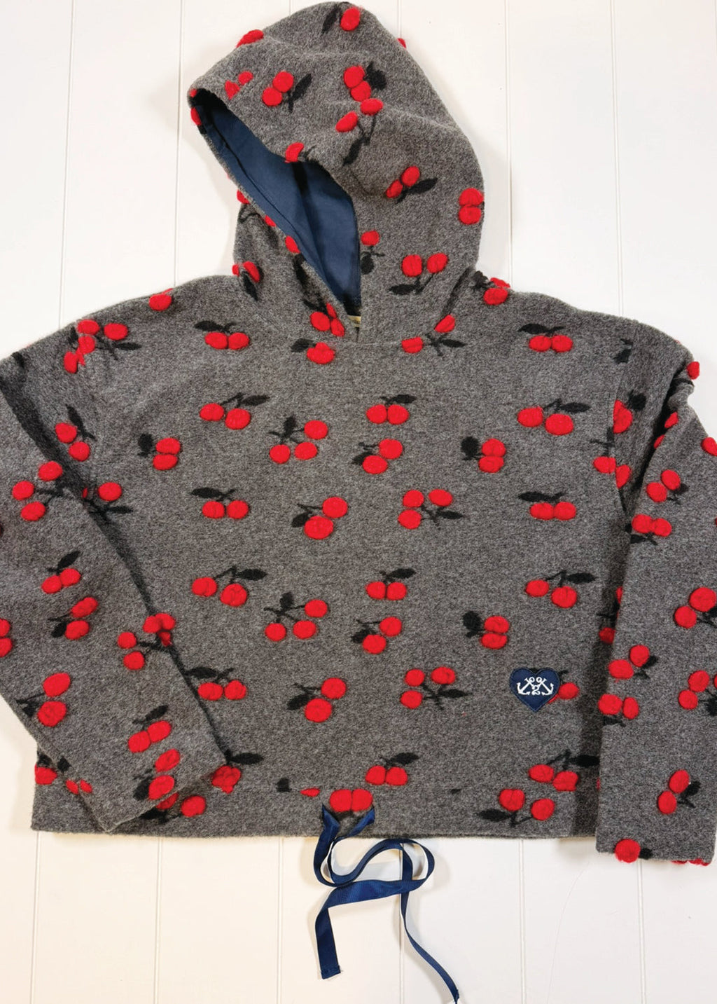 Gray hoodie with red cherry pattern on a white background
