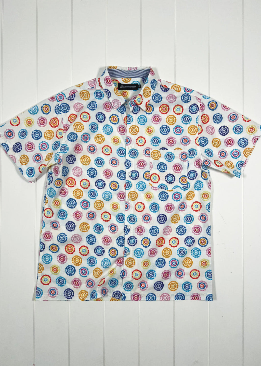 Colorful patterned shirt on a white wooden background
