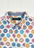Colorful circular patterned shirt with a brand label on a white background