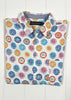 Colorful circular patterned shirt on a white background