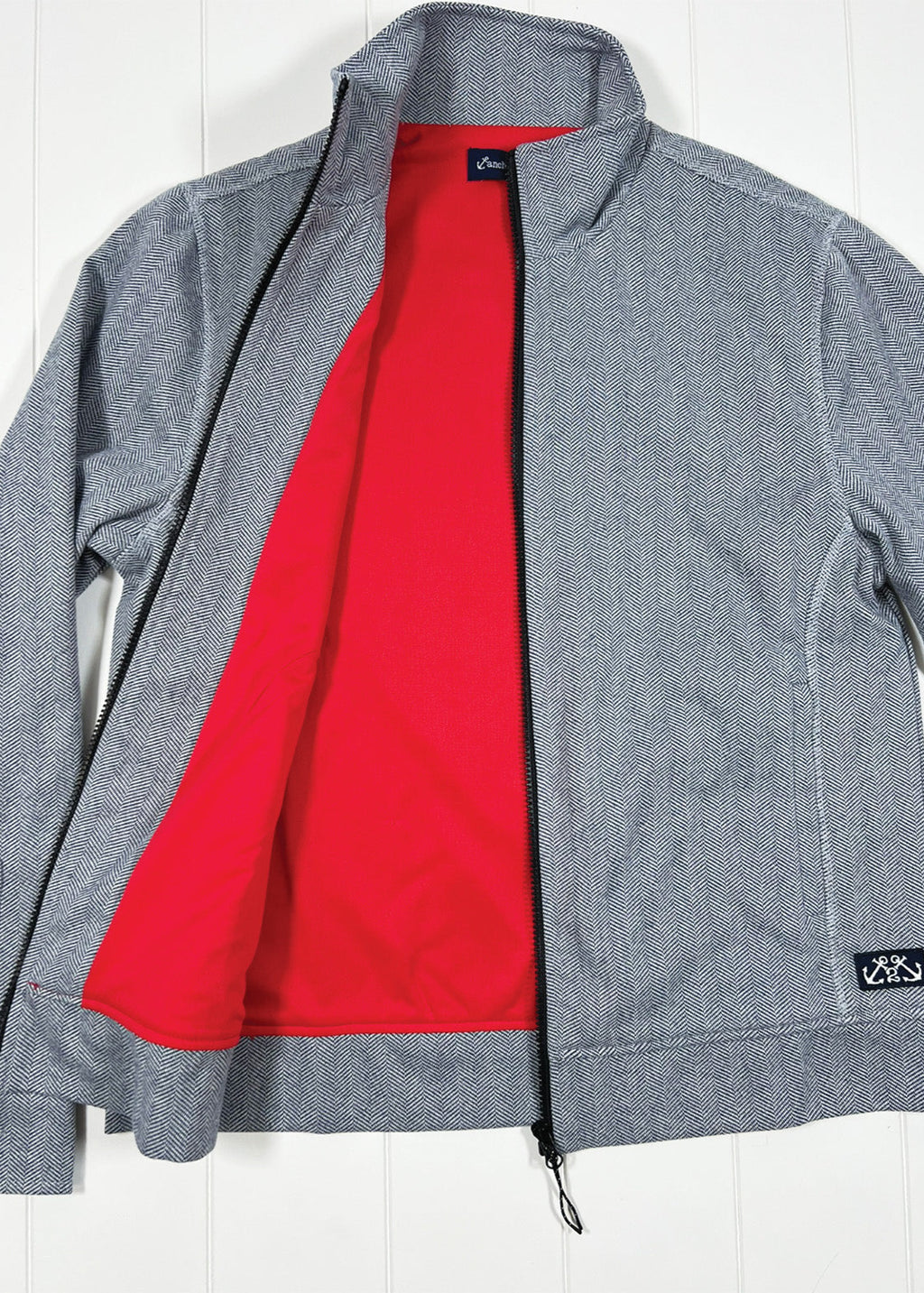 Gray jacket with red lining on a white background