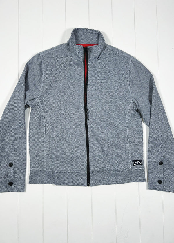 Gray jacket with black buttons on a white wooden background