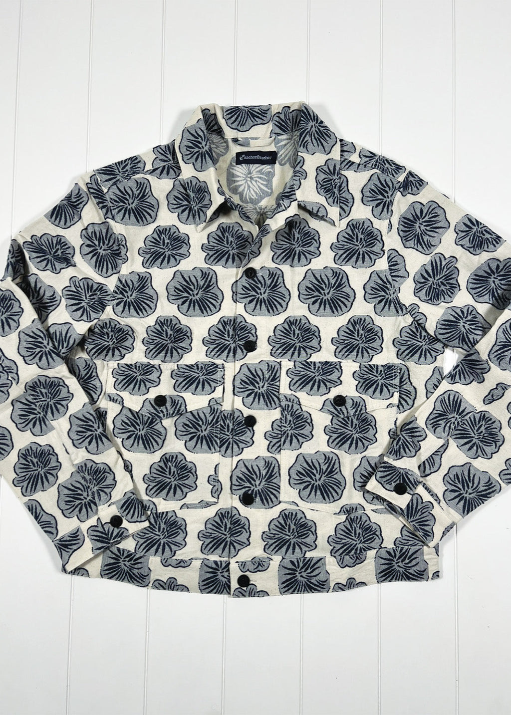 Floral patterned shirt on a white wooden background