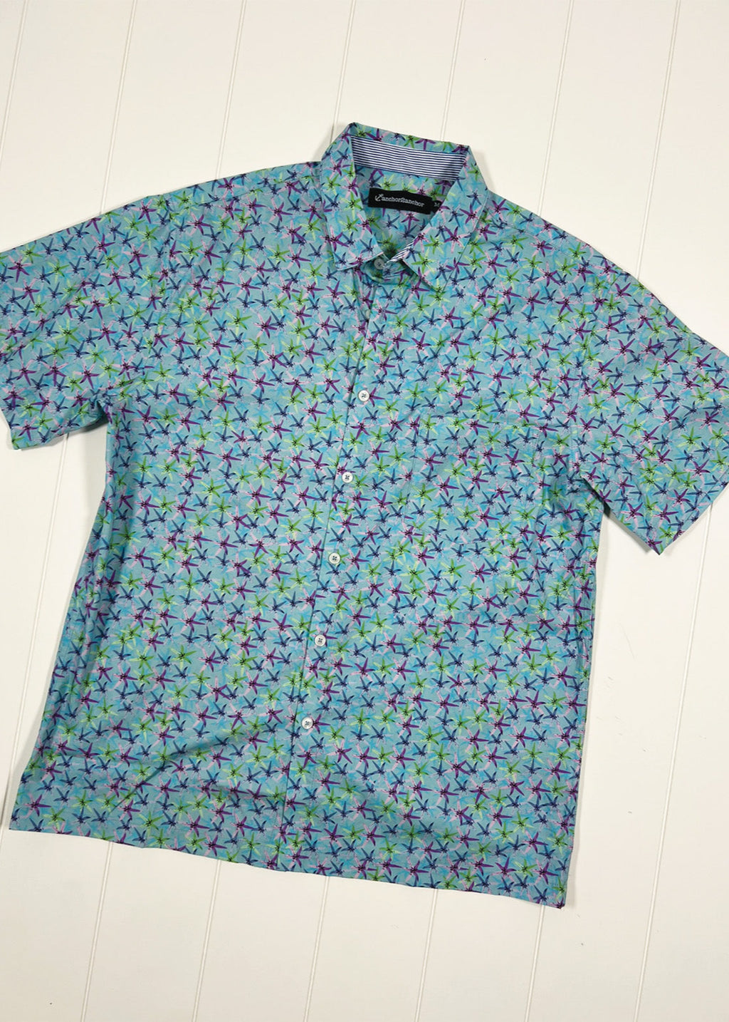 Short-sleeve shirt with colorful pattern on a white background