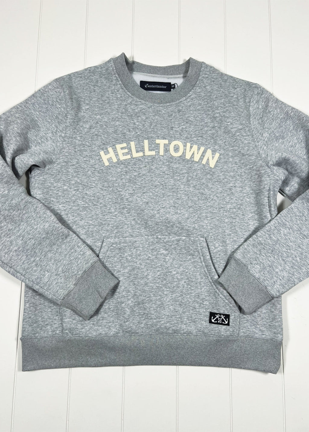 Gray sweatshirt with 'HELLTOWN' text on a white background
