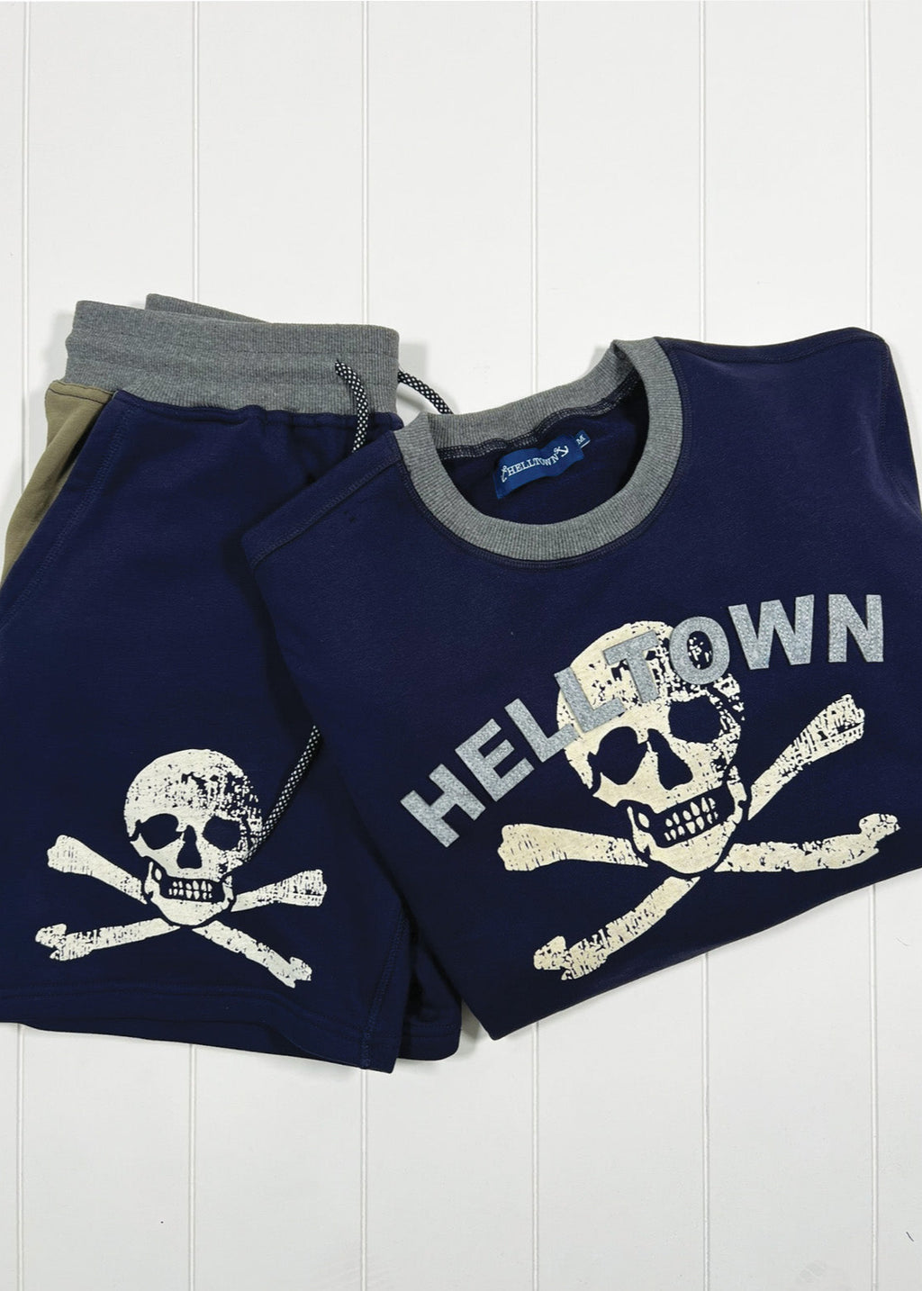 Navy blue sweatshirt with skull and crossbones design and 'HELLDOW' text on a white background