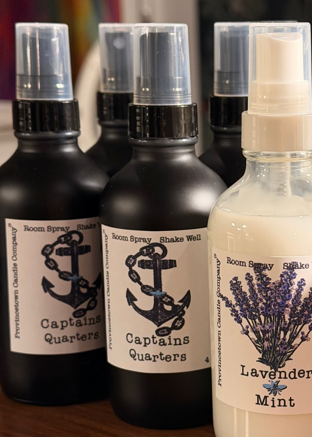 Room spray bottles with labels indicating 'Captains Quarters' and 'Lavender Mint'.