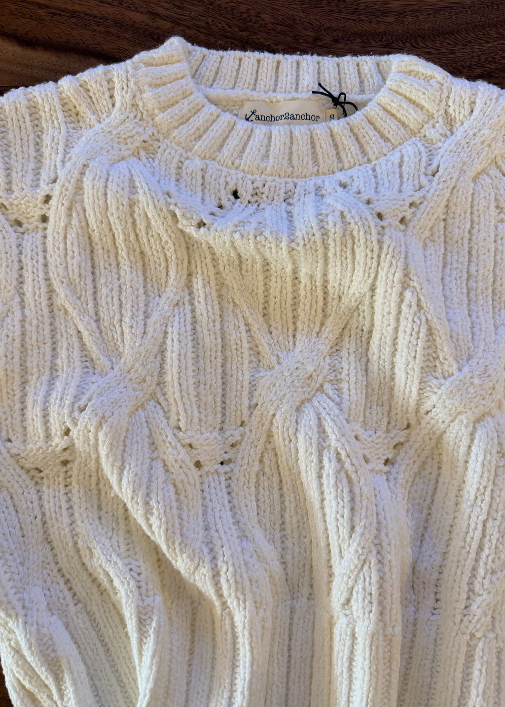 Close-up of a textured white fabric with a subtle pattern