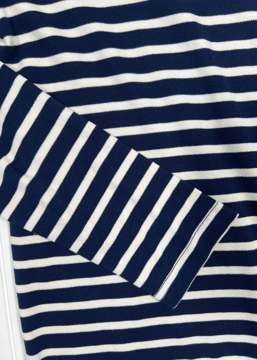 Navy and white striped fabric with geometric pattern