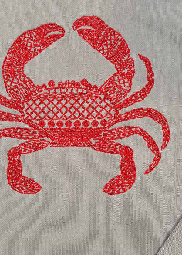 Red crab design on a gray background