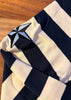 Nautical-themed sweater with star design on a wooden surface