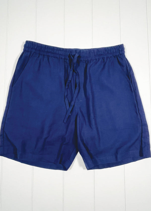 Blue shorts on a white wooden background