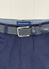 Navy pants with a patterned belt and visible brand label against a white background