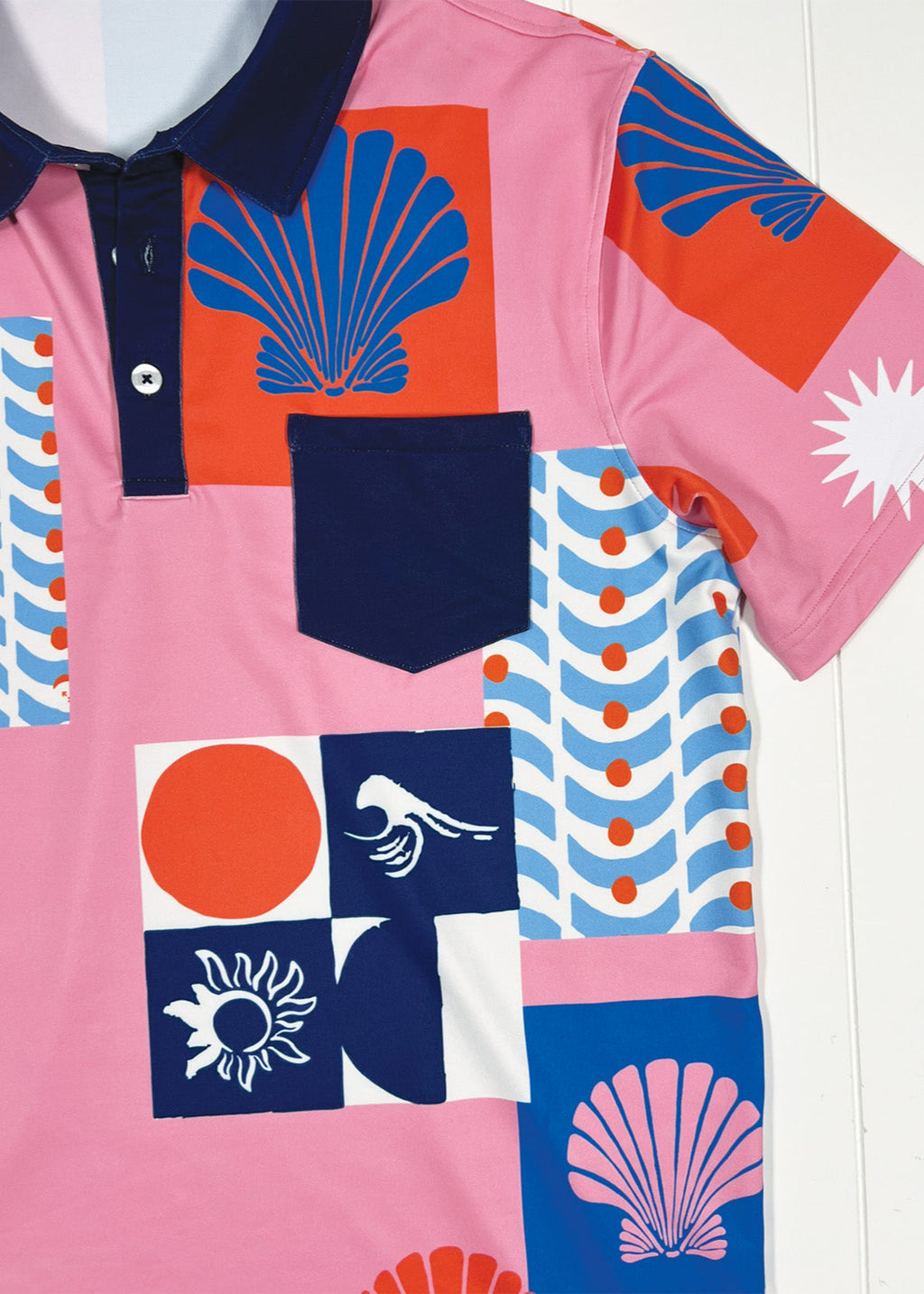 Colorful polo shirt with geometric patterns on a white background