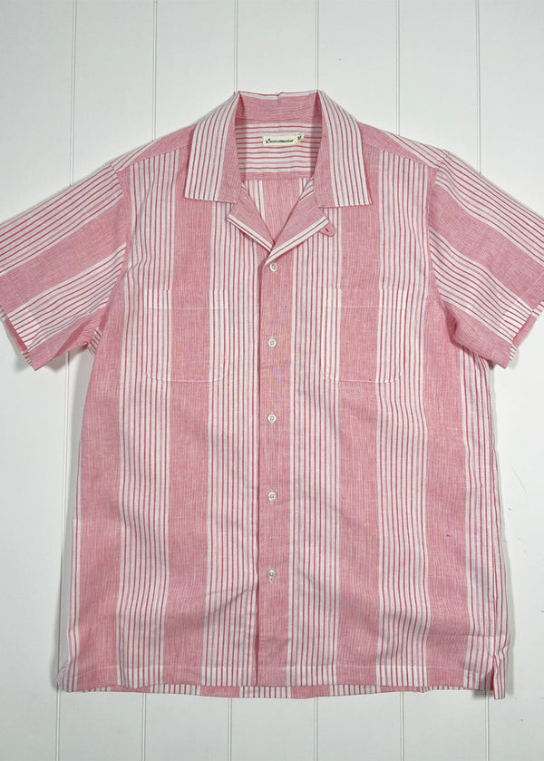 Red and white striped shirt on a white wooden background