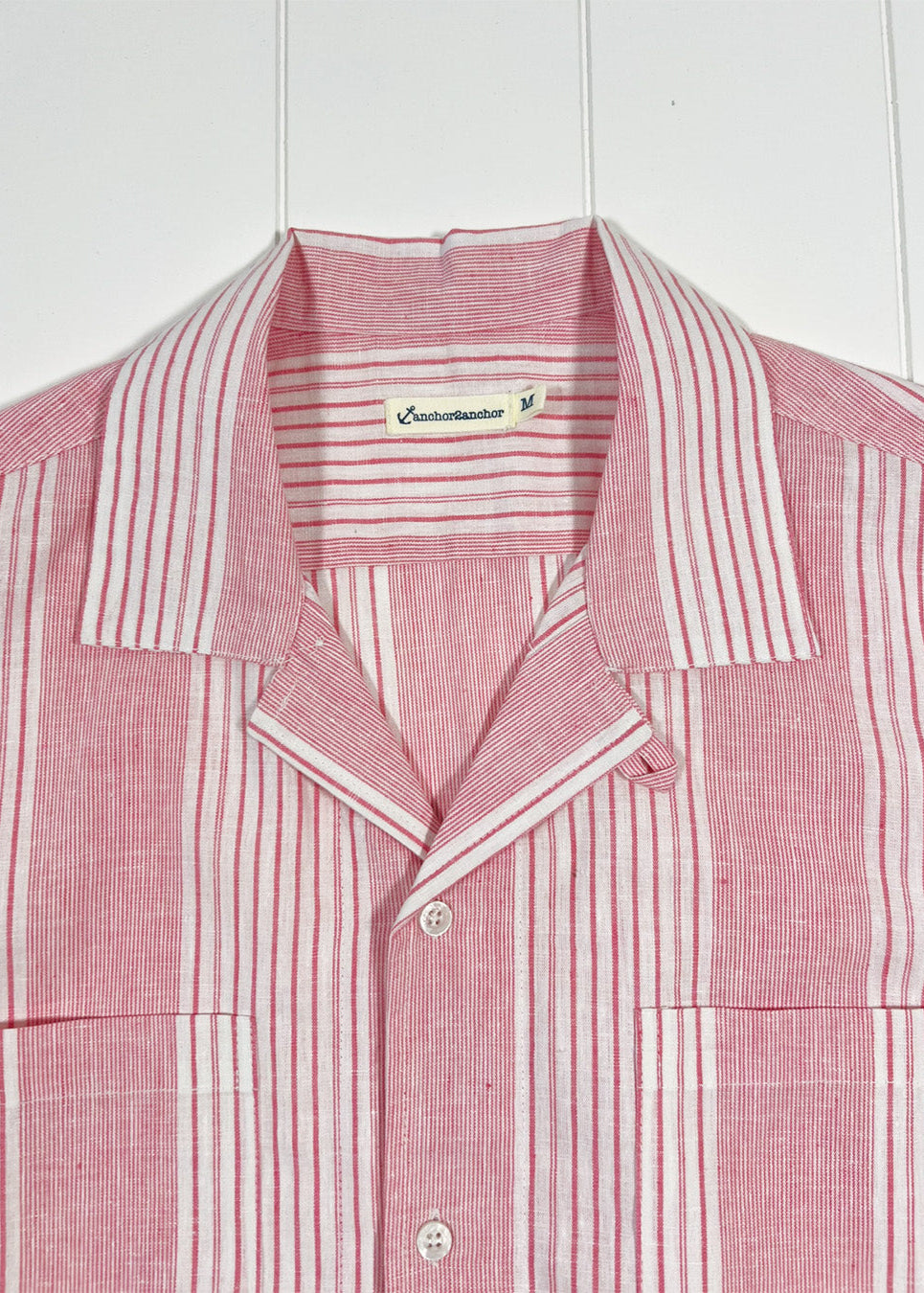 Red and white striped shirt with collar on a white background