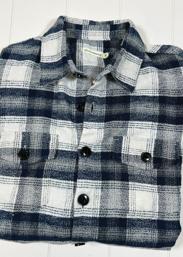 Plaid shirt with black buttons on a white background