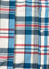 Close-up of a plaid shirt with blue, red, and white colors.