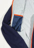Gray and navy jacket with orange trim on a white background