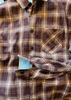 Brown and yellow plaid shirt with a button-up front.