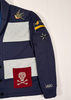 Navy blue jacket with various patches including a skull and crossbones design, displayed against a white background.