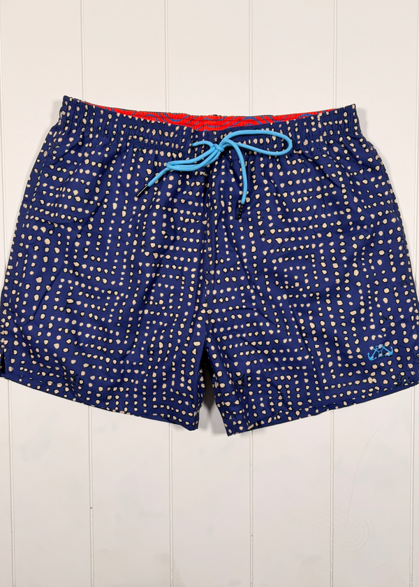 Blue patterned shorts with a red interior lining on a white background