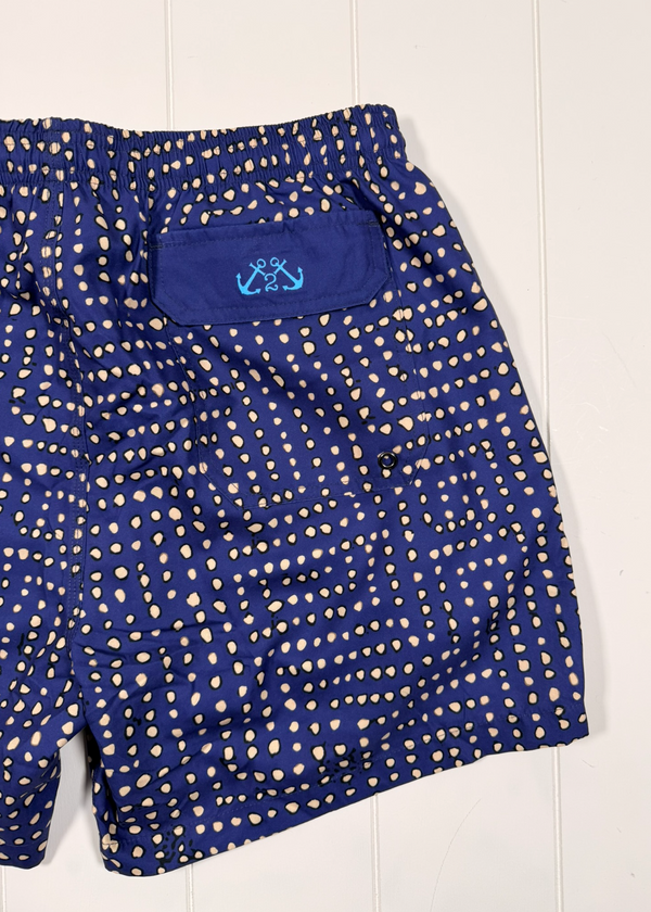 Blue shorts with white pattern on a white background