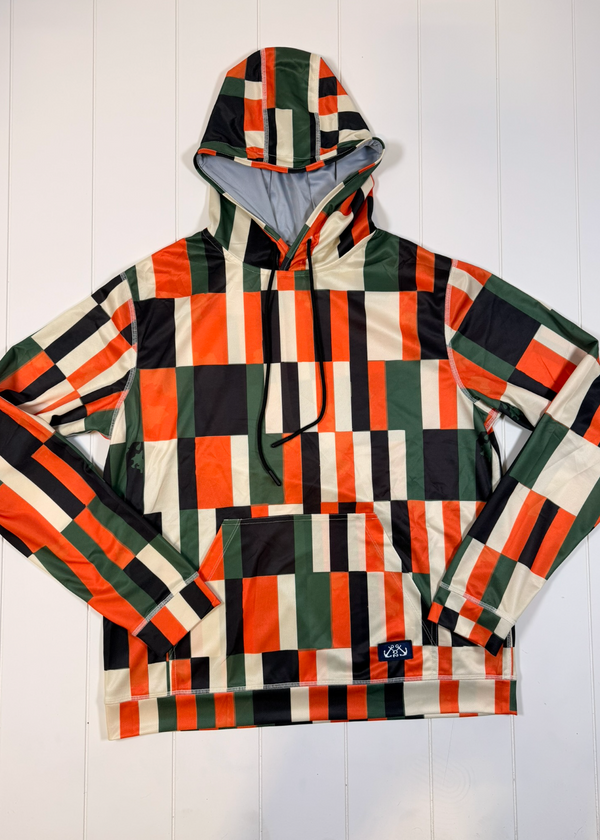 Colorful checkered hoodie on a white wooden background