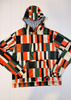 Colorful checkered hoodie on a white wooden background