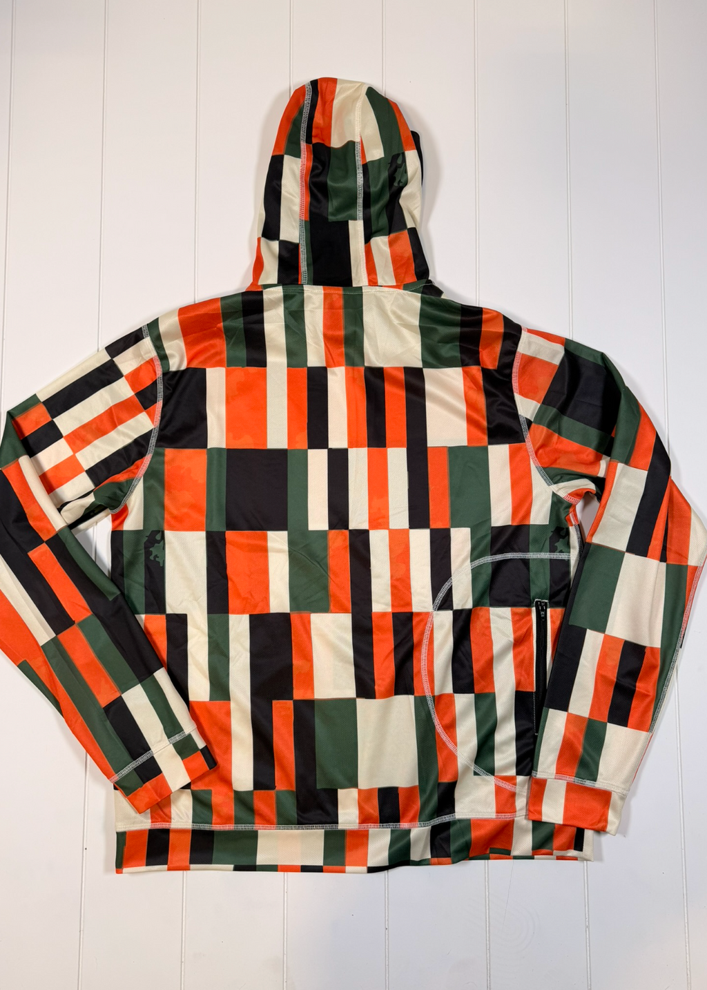 Colorful checkered jacket on a white wooden background