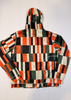 Colorful checkered jacket on a white wooden background