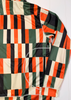 Checkered jacket with orange, green, and black pattern on a white background