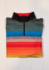 Multicolored striped sleeveless jacket on a white wooden background