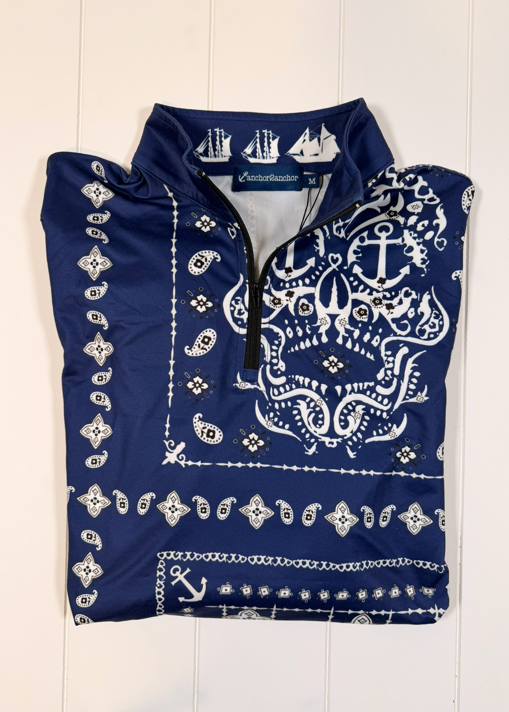 Navy blue shirt with white bandana pattern on a white background