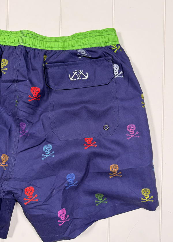 Blue shorts with colorful skull and crossbones pattern on a white background