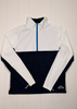 White and navy half-zip pullover with a brand logo on a wooden background