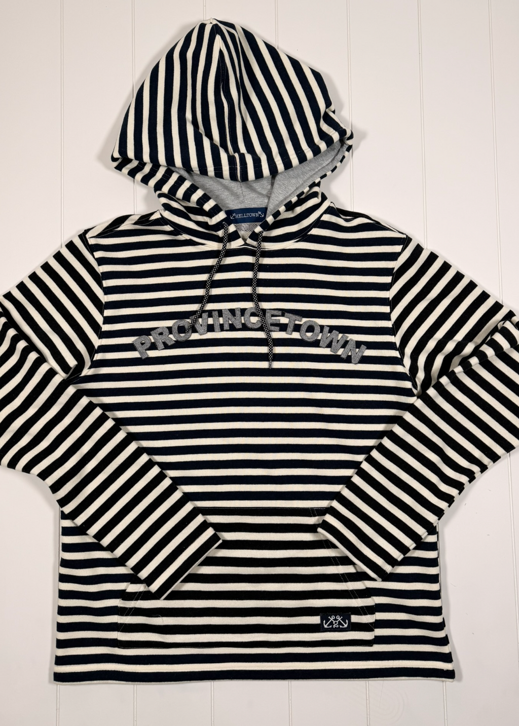 Black and white striped hoodie with 'Palm Beach' text on a white background
