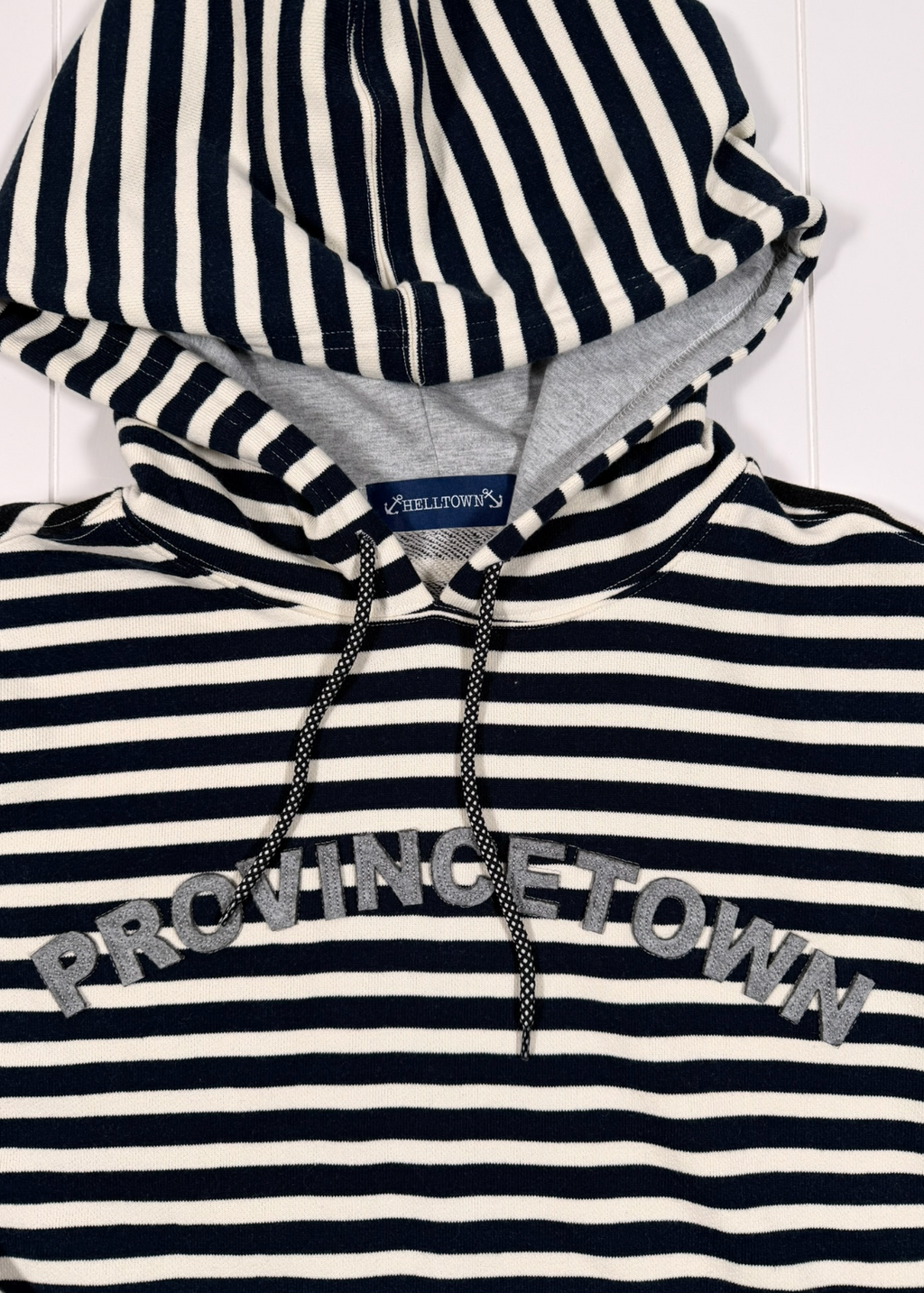 Navy and white striped hoodie with 'Provincetown' text on a white background