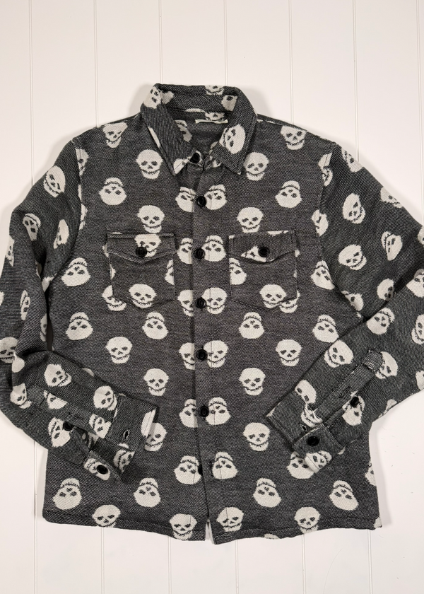 Gray shirt with skull pattern on a white background