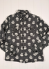Gray shirt with skull pattern on a white background