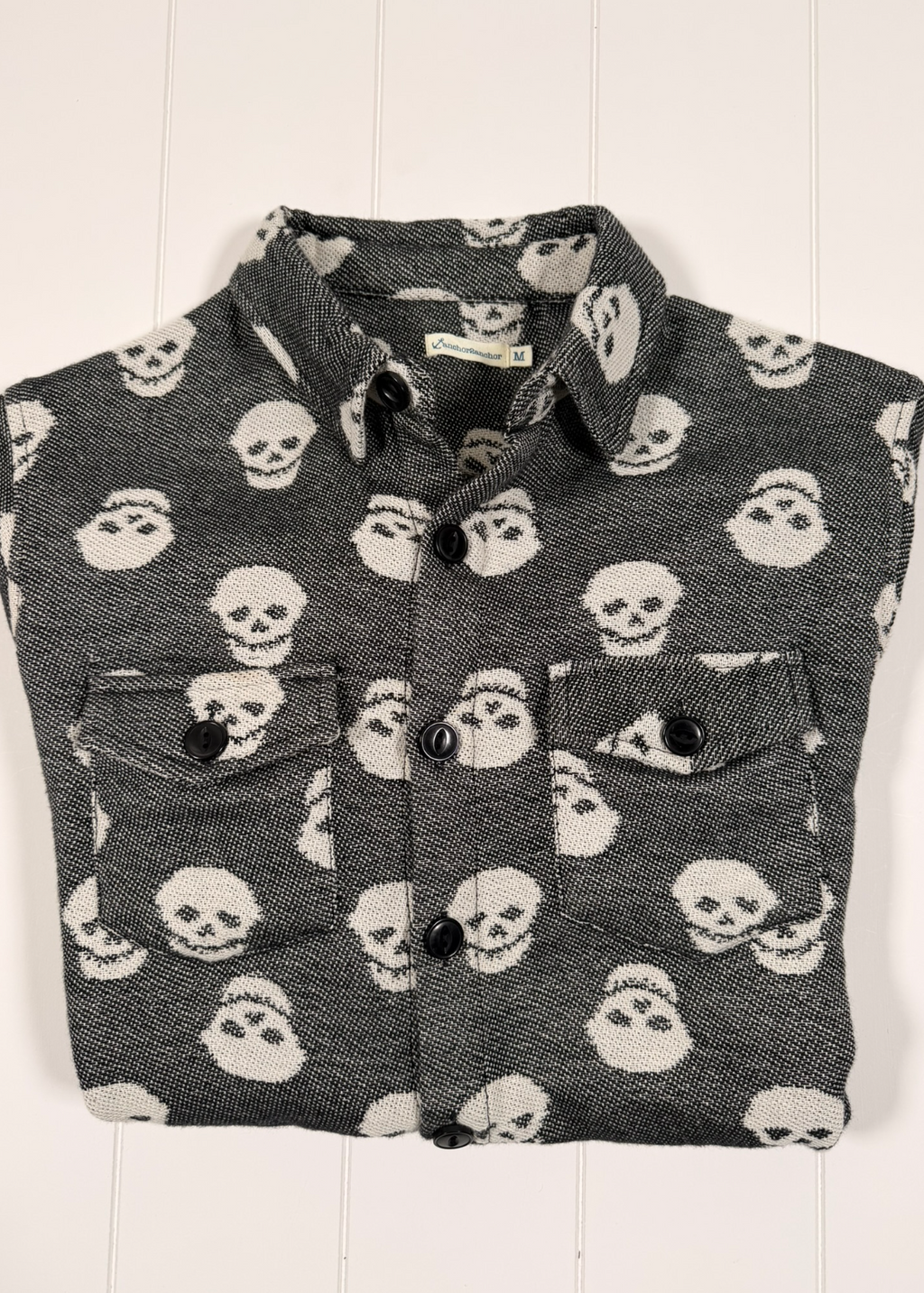 Flannel shirt with skull pattern on a white background