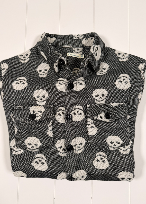 Flannel shirt with skull pattern on a white background