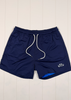 Navy blue shorts with a white drawstring on a light wooden floor.