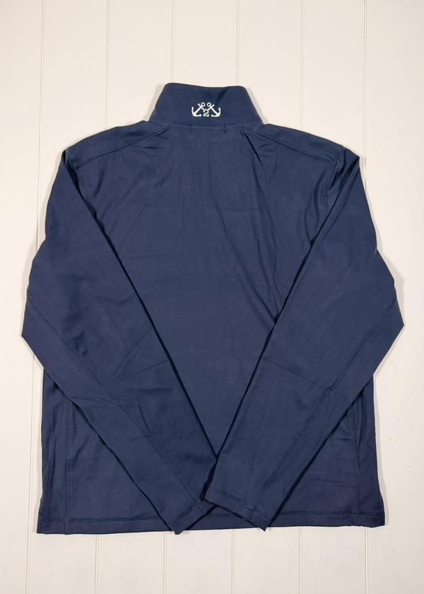 Navy blue pullover with a brand logo on a white wooden background