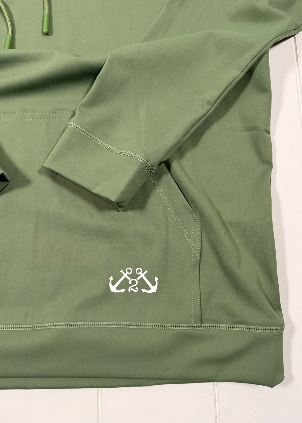 Green jacket with a logo on a white background