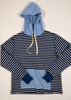 Navy and white striped hoodie with blue hood and cuffs on a light wooden background