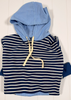 Blue and white striped hoodie with a hood on a white wooden background